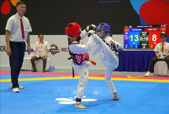 Trận thi đấu Taekwondo ở lứa tuổi dưới 12. Ảnh: Trung Tuyến - TTXVN