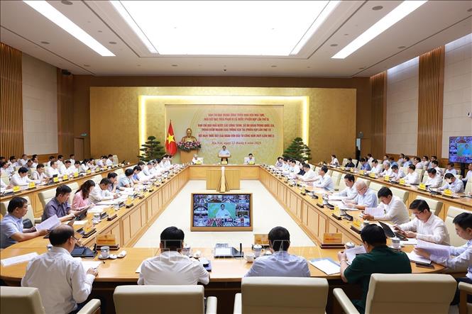 Prime Minister Pham Minh Chinh on June 22 chairs a national teleconference to speed up substandard housing eradication, key transport projects, and public investment disbursement. VNA Photo: Dương Giang