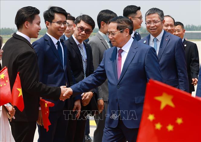 Lễ đón Thủ tướng Phạm Minh Chính tại Sân bay quốc tế Tân Hải, thành phố Thiên Tân, Trung Quốc. Ảnh: Dương Giang-TTXVN
