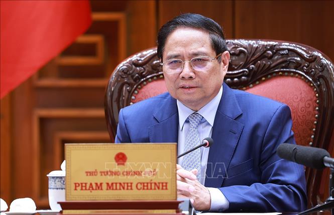 Thủ tướng Phạm Minh Chính chủ trì cuộc họp về đảm bảo cân bằng thương mại với Hoa Kỳ. Ảnh: Dương Giang-TTXVN
