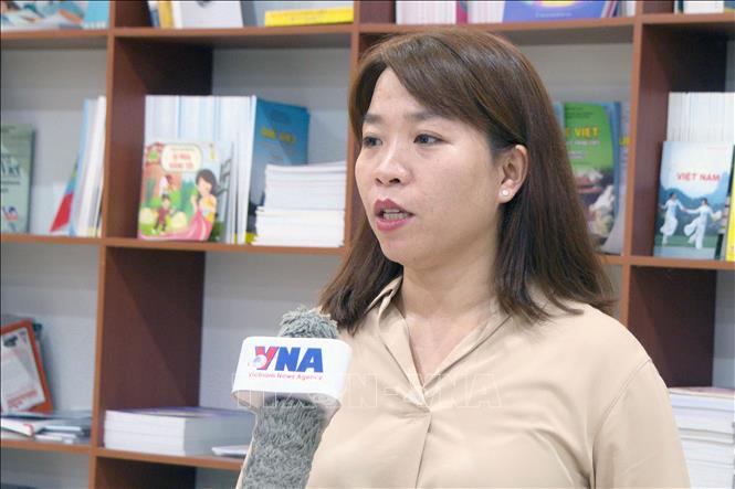 Chị Nguyễn Thị Thu Huyền, kiều bào tại Lào tin tưởng vào quyết tâm đổi mới của Việt Nam. Ảnh: Bá Thành - PV TTXVN tại Lào