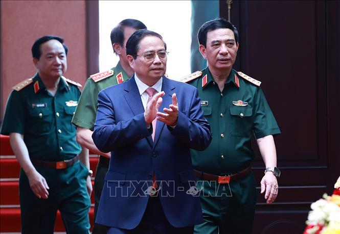 Thủ tướng Phạm Minh Chính đến dự Hội nghị quân chính toàn quân 6 tháng đầu năm 2025. Ảnh: Dương Giang-TTXVN
