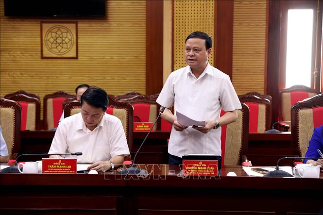  Các đại biểu thảo luận tại buổi làm việc. Ảnh: Quang Cường - TTXVN