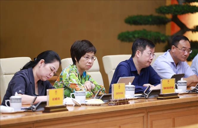 Các đại biểu tham dự Phiên họp thứ 6 của BCĐ xoá nhà tạm, nhà dột nát. Ảnh: Dương Giang-TTXVN 
