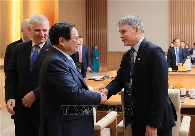 Thủ tướng Phạm Minh Chính với Đoàn Hội đồng kinh doanh Hoa Kỳ - ASEAN (USABC). Ảnh: Dương Giang-TTXVN