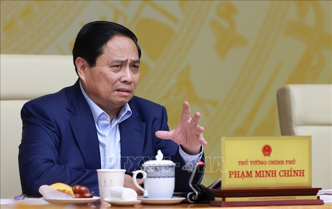 Thủ tướng Phạm Minh Chính chủ trì Hội nghị Chính phủ với địa phương về kịch bản tăng trưởng kinh tế năm 2025. Ảnh: Dương Giang-TTXVN 

