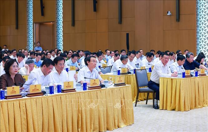 Các đại biểu dự Hội nghị toàn quốc sơ kết, đánh giá kết quả thực hiện việc tháo gỡ khó khăn, vướng mắc cho các dự án, đất đai. Ảnh: Dương Giang-TTXVN
