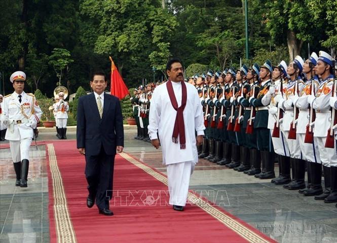 Chủ tịch nước Nguyễn Minh Triết chủ trì lễ đón Tổng Thống Sri Lanka Mahinda Rajapaksa thăm chính thức Việt Nam (Hà Nội, 22/10/2009). Ảnh: Nguyễn Khang - TTXVN