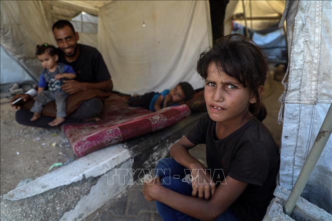 Người dân Palestine tại trại tị nạn ở Gaza. Ảnh: THX/TTXVN