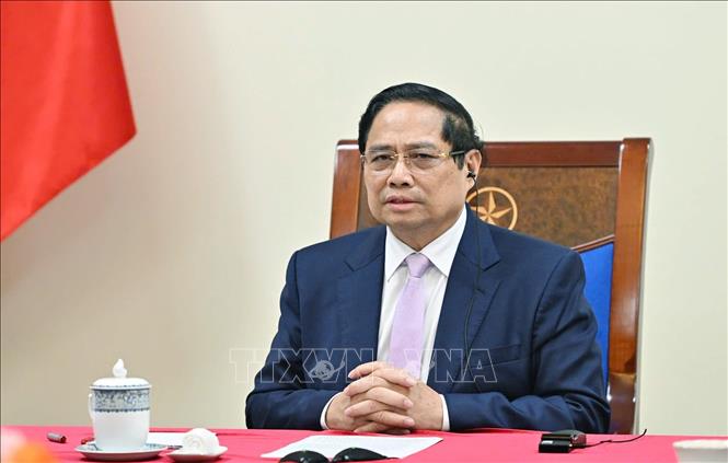 Thủ tướng Phạm Minh Chính điện đàm với Thủ tướng Malaysia Anwar Ibrahim. Ảnh: Dương Giang-TTXVN 
