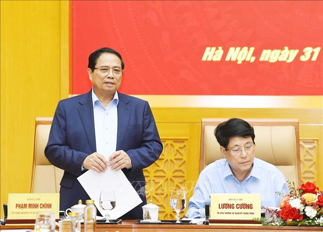 Prime Minister Pham Minh Chinh speaks at the meeting. VNA Photo/Photo by courtesy