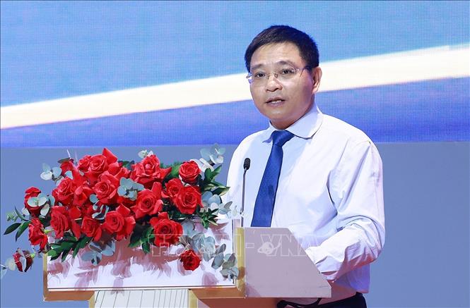 Bộ trưởng Bộ Tài chính Nguyễn Văn Thắng công bố Quyết định của Thủ tướng Chính phủ thành lập Ban Chỉ đạo quốc gia về Trung tâm tài chính quốc tế tại Việt Nam và Quyết định của Thủ tướng Chính phủ ban hành Kế hoạch hành động triển khai xây dựng Trung tâm tài chính quốc tế tại Việt Nam. Ảnh: Dương Giang-TTXVN