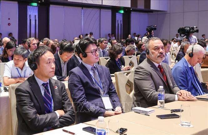 Các đại biểu tham dự Hội nghị quán triệt, triển khai Nghị quyết của Quốc hội về Trung tâm tài chính quốc tế tại Việt Nam. Ảnh: Dương Giang-TTXVN