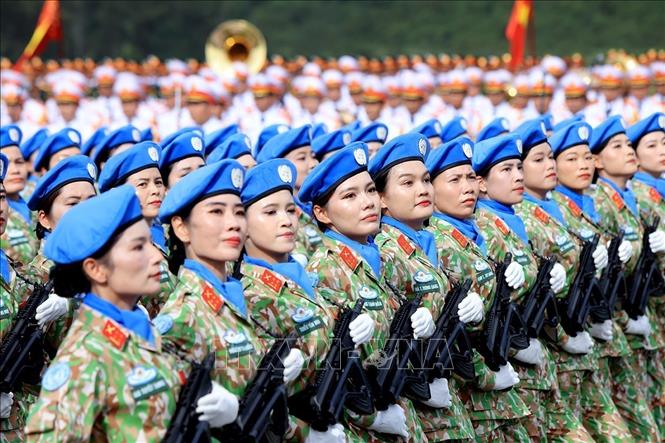 The rehearsal sees the formation of seven female military units covering military music, medical officers, Vietnamese peacekeepers, special forces, communications soldiers, ethnic militia, and southern guerrillas, alongside two female police units representing traffic police officers and special task force personnel. VNA Photo: Tuấn Anh 