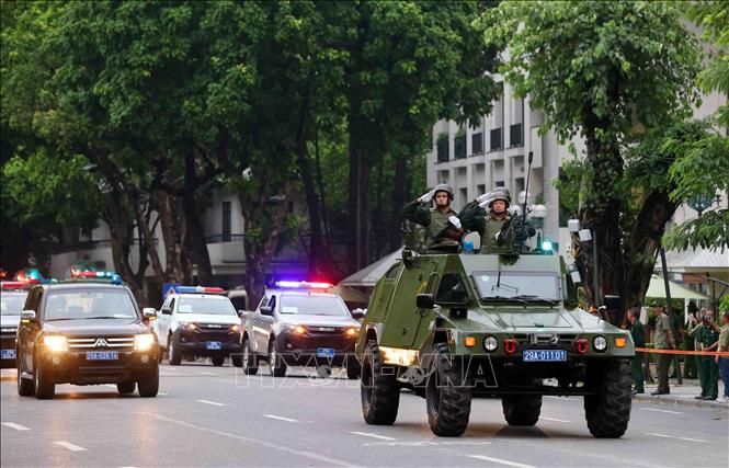 The mobile police force's vehicles take part in the rehearsal. VNA Photo: Phạm Kiên 