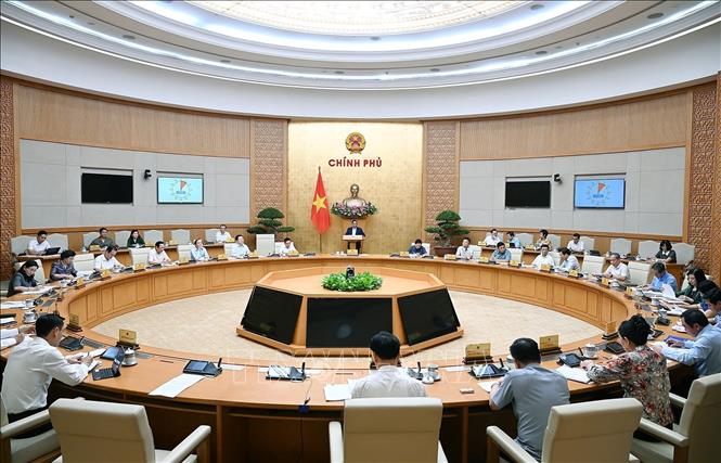 Thủ tướng Phạm Minh Chính chủ trì cuộc họp Chính phủ về tháo gỡ khó khăn, vướng mắc trong thực hiện chính quyền địa phương hai cấp. Ảnh: Dương Giang-TTXVN
