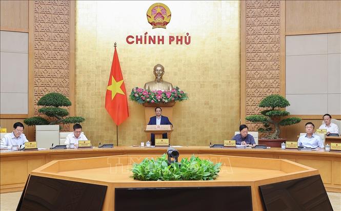 Thủ tướng Phạm Minh Chính chủ trì cuộc họp Chính phủ về tháo gỡ khó khăn, vướng mắc trong thực hiện chính quyền địa phương hai cấp. Ảnh: Dương Giang-TTXVN