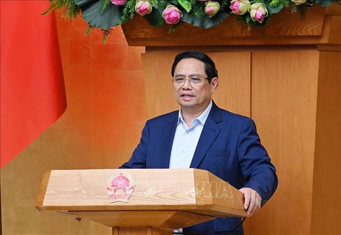 Thủ tướng Phạm Minh Chính chủ trì cuộc họp Chính phủ về tháo gỡ khó khăn, vướng mắc trong thực hiện chính quyền địa phương hai cấp. Ảnh: Dương Giang-TTXVN