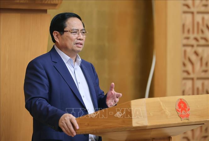 Thủ tướng Phạm Minh Chính chủ trì cuộc họp Chính phủ về tháo gỡ khó khăn, vướng mắc trong thực hiện chính quyền địa phương hai cấp. Ảnh: Dương Giang-TTXVN
