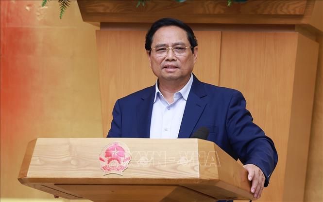 Thủ tướng Phạm Minh Chính chủ trì cuộc họp Chính phủ về tháo gỡ khó khăn, vướng mắc trong thực hiện chính quyền địa phương hai cấp. Ảnh: Dương Giang-TTXVN
