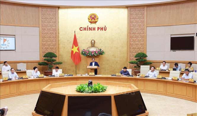 Thủ tướng Phạm Minh Chính chủ trì cuộc họp Chính phủ về tháo gỡ khó khăn, vướng mắc trong thực hiện chính quyền địa phương hai cấp. Ảnh: Dương Giang-TTXVN
