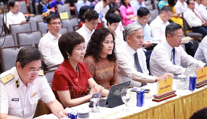 Các đại biểu tham dự Hội nghị tổng kết Chương trình và Phong trào thi đua “Cả nước chung tay xóa nhà tạm, nhà dột nát”. Ảnh: Dương Giang-TTXVN  
