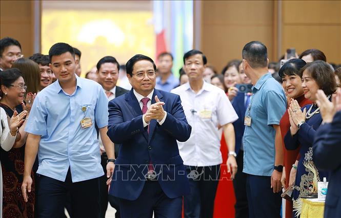 Thủ tướng Phạm Minh Chính đến Hội nghị gặp mặt các doanh nghiệp với chủ đề “80 năm doanh nghiệp đồng hành cùng đất nước”. Ảnh: Dương Giang– TTXVN
