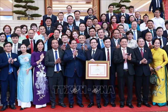 Thủ tướng Phạm Minh Chính với lãnh đạo các doanh nghiệp. Ảnh: Dương Giang– TTXVN
