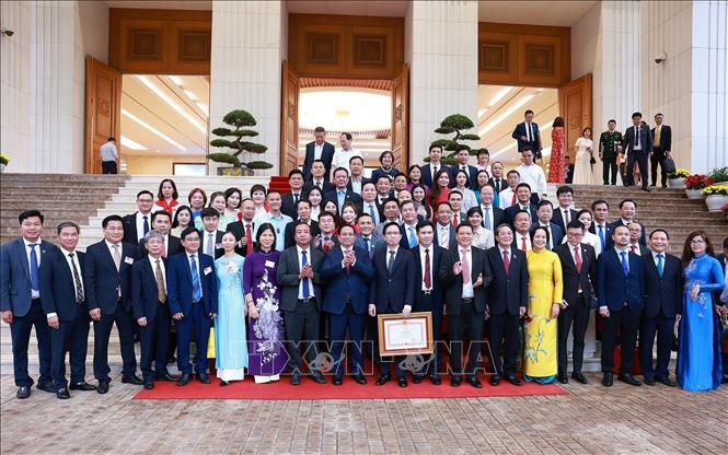 Thủ tướng Phạm Minh Chính với lãnh đạo các doanh nghiệp. Ảnh: Dương Giang– TTXVN
