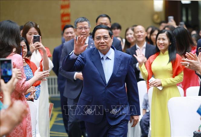 Thủ tướng Phạm Minh Chính gặp cộng đồng người Việt Nam tại Trung Quốc. Ảnh: Dương Giang-TTXVN
