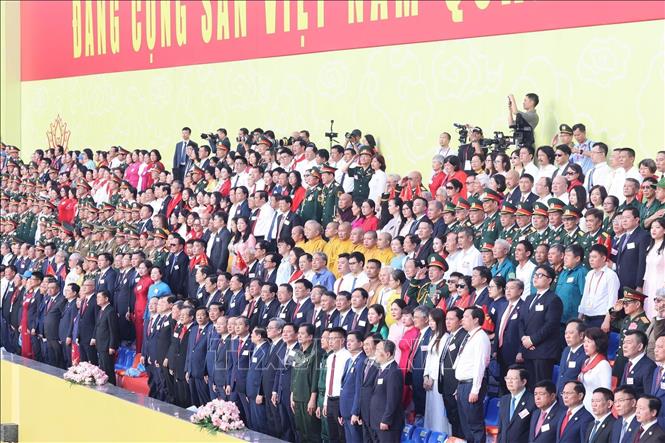 Vietnamese delegates and international guests at the grand parade. VNA Photo