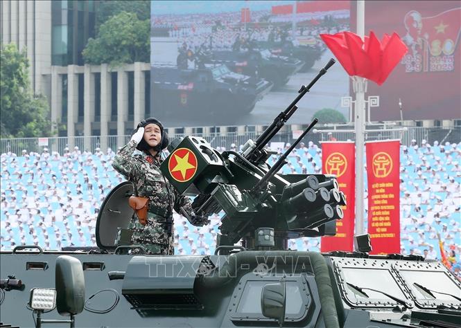 The armored corps marches past the central stage. VNA Photo
