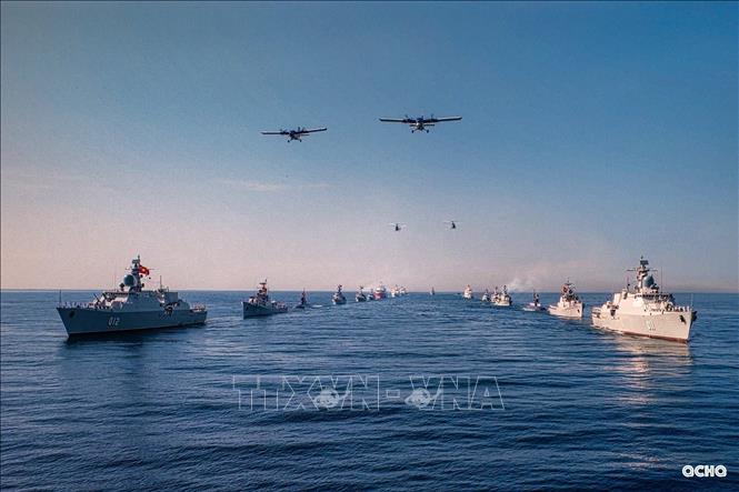A formation of ships and aircraft participating in the sea parade. VNA Photo/Photo by courtesy