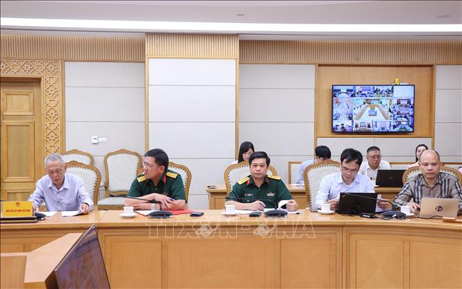 Các đại biểu dự cuộc họp tại điểm cầu Trụ sở Chính phủ. Ảnh: Văn Điệp – TTXVN