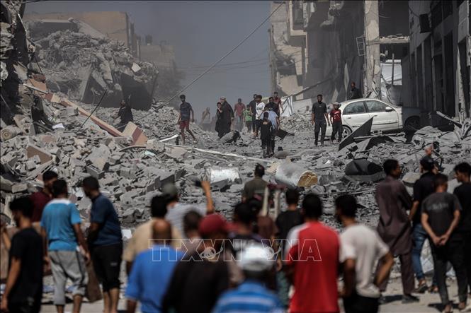 Đống đổ nát sau cuộc không kích của Israel xuống thành phố Gaza ngày 12/9/2025. Ảnh: THX/TTXVN