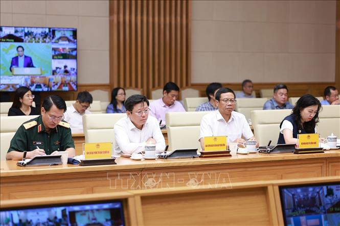 Đại diện các ban, bộ, ngành tham dự Phiên họp lần thứ 14 của Ban Chỉ đạo Quốc gia về chống khai thác hải sản bất hợp pháp. Ảnh: Dương Giang-TTXVN 
