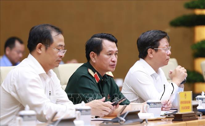 Đại diện các bộ, ngành tham dự Phiên họp lần thứ 14 của Ban Chỉ đạo Quốc gia về chống khai thác hải sản bất hợp pháp. Ảnh: Dương Giang-TTXVN 
