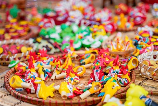 To he - traditional Vietnamese toys made from colourful glutinous rice powder - on display on Hang Ma street. VNA Photo: Khánh Hoà