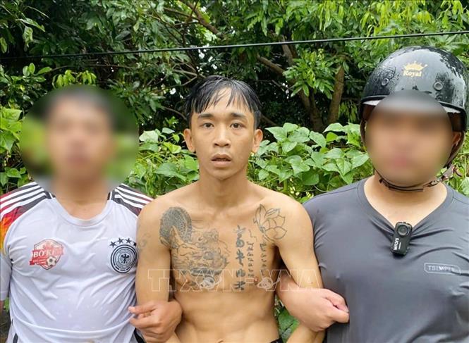 Đối tượng Mai Văn Phúc bị bắt giữ theo lệnh truy nã. Ảnh: TTXVN phát