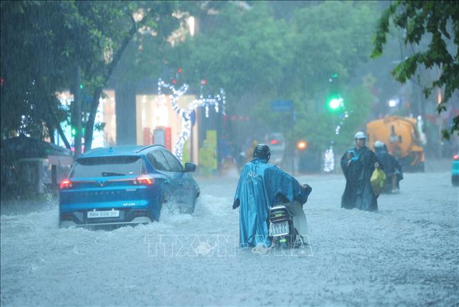 Nước ngập khắp nơi. Ảnh: Hoàng Hiếu-TTXVN
