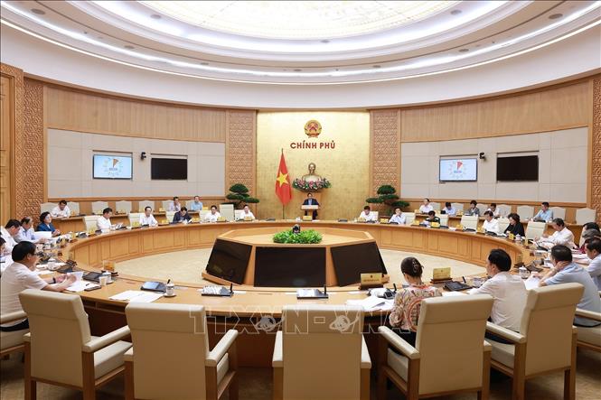 Chính chủ trì họp đánh giá kết quả vận hành mô hình chính quyền địa phương hai cấp. Ảnh: Dương Giang-TTXVN
