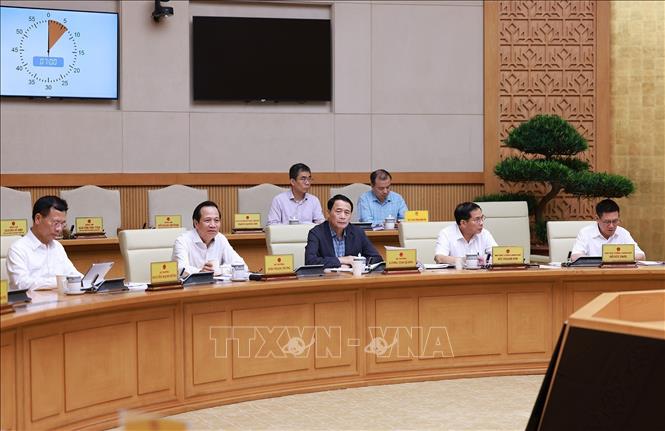 Lãnh đạo các bộ, ngành tham dự cuộc họp đánh giá kết quả vận hành mô hình chính quyền địa phương hai cấp. Ảnh: Dương Giang-TTXVN