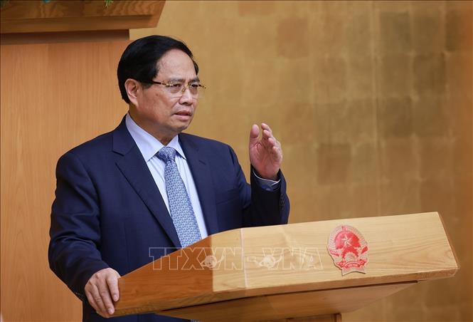 Thủ tướng Phạm Minh Chính chủ trì họp đánh giá kết quả vận hành mô hình chính quyền địa phương hai cấp. Ảnh: Dương Giang-TTXVN
