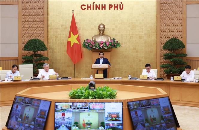 Prime Minister Pham Minh Chinh chairs the Government's meeting on October 5. VNA Photo: Dương Giang
