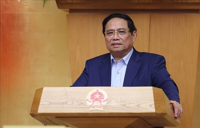 Prime Minister Pham Minh Chinh chairs the Government's meeting on October 5. VNA Photo: Dương Giang