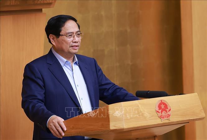 Prime Minister Pham Minh Chinh chairs the Government's meeting on October 5. VNA Photo: Dương Giang