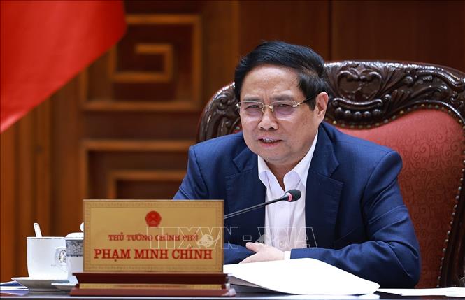 Thủ tướng Phạm Minh Chính chủ trì cuộc họp Thường trực Chính phủ với các địa phương để tháo gỡ khó khăn, vướng mắc cho các dự án dự án tồn đọng. Ảnh: Dương Giang-TTXVN 
