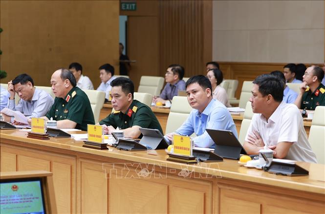 Đại diện các bộ, ngành tham dự Phiên họp lần thứ 16 của Ban Chỉ đạo Quốc gia về chống khai thác hải sản bất hợp pháp. Ảnh: Dương Giang-TTXVN 
