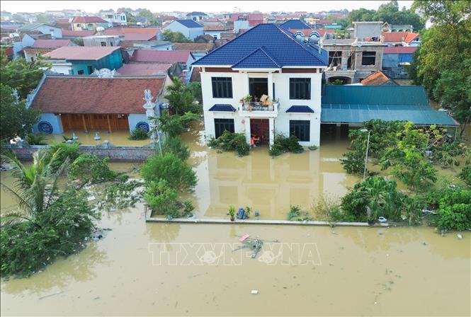 Nước nhấn chìm nhiều ngôi nhà tại các tổ dân phố Yên Viên, Vân Hà, Thổ Hà, phường Vân Hà, tỉnh Bắc Ninh. Ảnh: Phan Phương - TTXVN