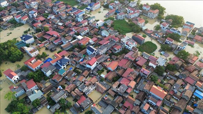 Một góc phường Vân Hà bị ngập sâu trong nước. Ảnh: Trần Việt - TTXVN 
